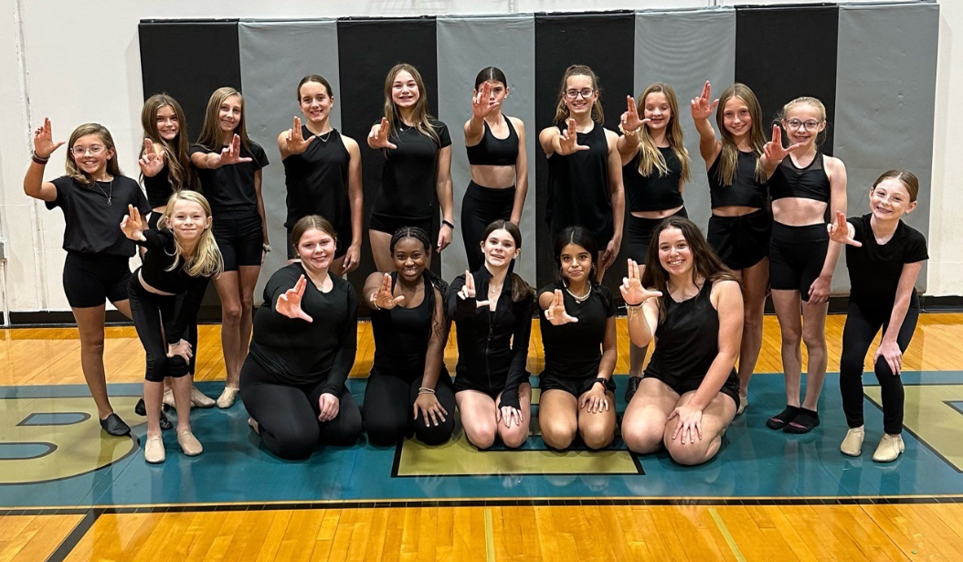 The first Liberty dance team stops to pose for their very first group shot.