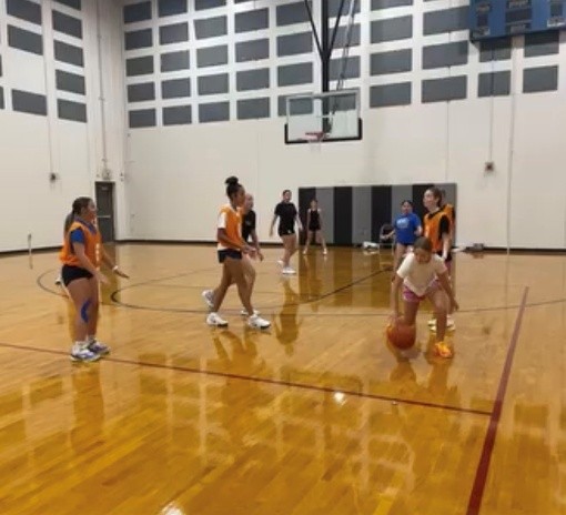 Several girls work hard at open gym.