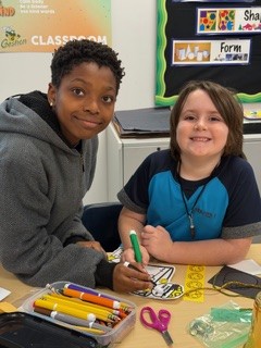 7th graders went to Goshen before St. Patrick's day to spend time making leprechaun traps with their first-grade buddies.