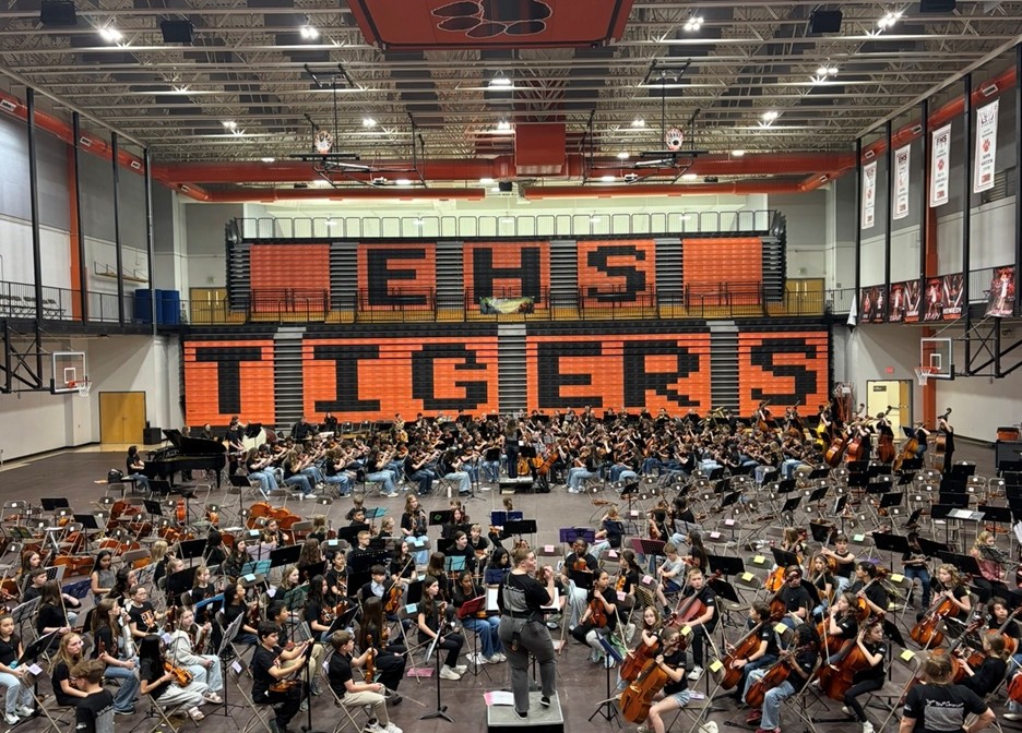 District 7 Orchestra students practice their pieces before the concert.