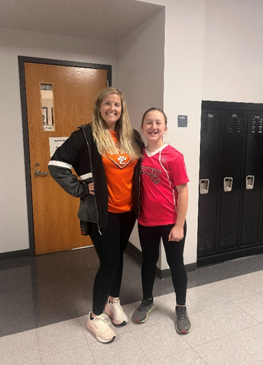 Mrs. Alyssa Smith and Emma Brynildsen stand together proudly supporting peer buddies.